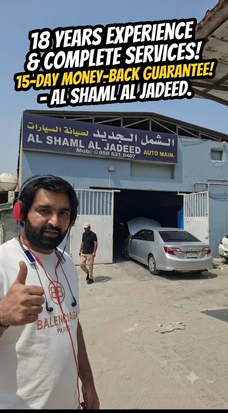 Workshop owner outside the Al Shaml Al Jadeed garage in Sharjah